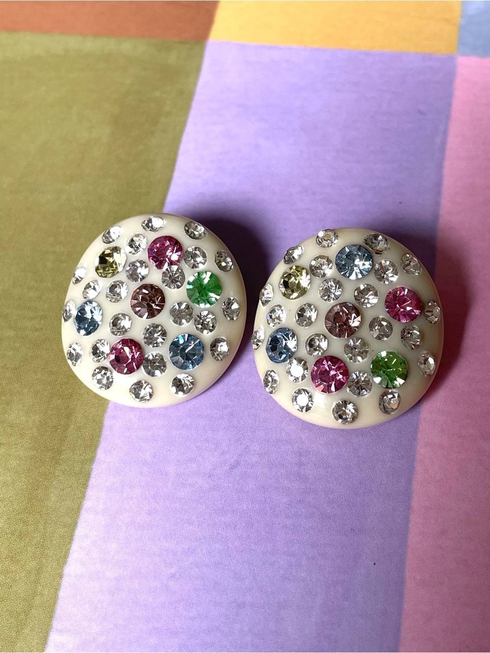 Vintage plastic/celluloid rounded clip-on earrings w/ colorful rhinestones